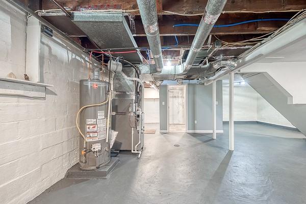 1603 Randolph Ln, Penn Hills, PA 15147 - unfinished basement featuring water heater and heating unit
