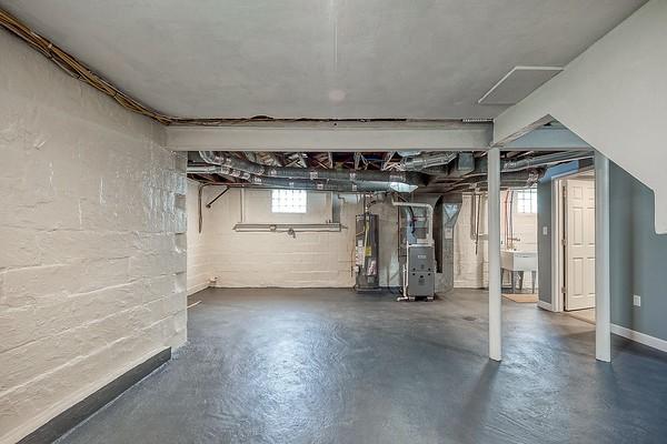 1603 Randolph Ln, Penn Hills, PA 15147 - below grade area with gas water heater, a sink, and heating unit