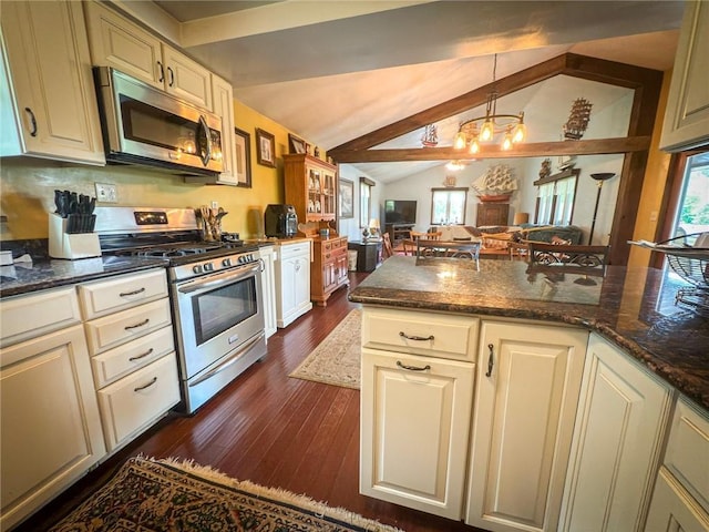 829 Saxonburg Rd, Jefferson Twp But, PA 16002 - kitchen featuring appliances with stainless steel finishes, a chandelier, dark wood finished floors, open floor plan, and dark stone countertops