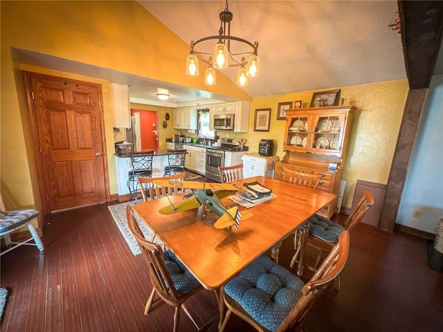 829 Saxonburg Rd, Jefferson Twp But, PA 16002 - dining space with vaulted ceiling, a chandelier, dark wood-style flooring, and baseboards