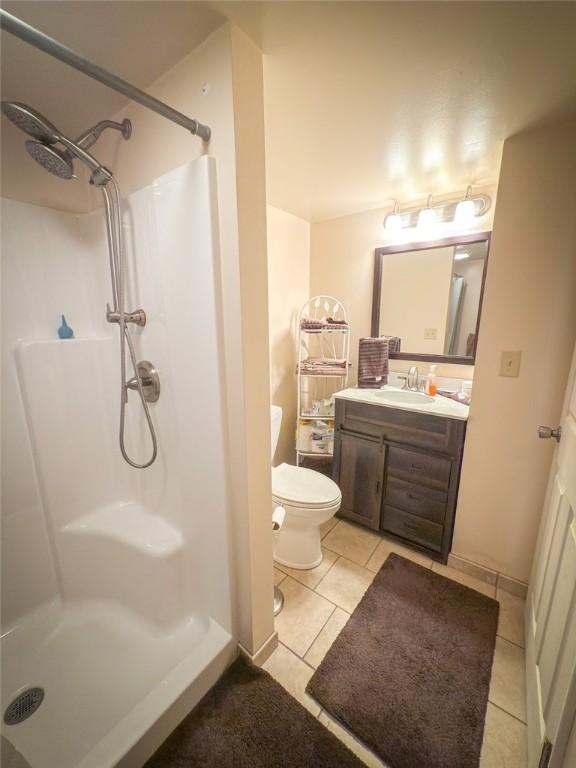 829 Saxonburg Rd, Jefferson Twp But, PA 16002 - full bath with a shower, tile patterned flooring, vanity, and toilet