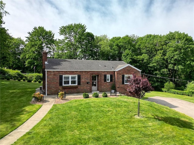 106 Richard Dr, Ross Twp, PA 15237 - ranch-style home featuring brick siding, a front yard, a chimney, and roof with shingles