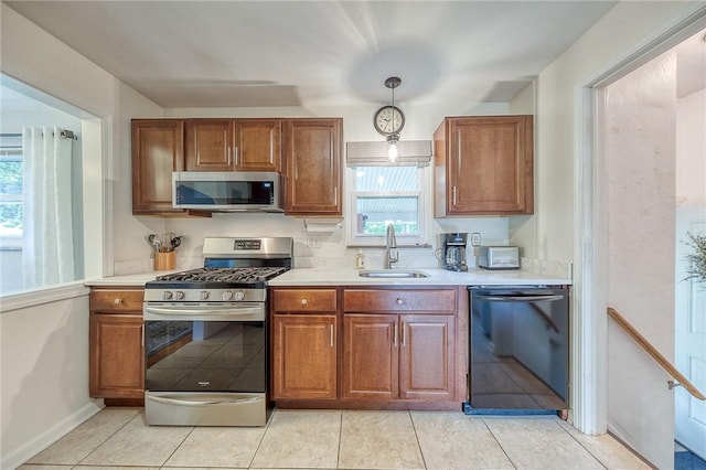 106 Richard Dr, Ross Twp, PA 15237 - kitchen featuring appliances with stainless steel finishes, a sink, light countertops, and healthy amount of natural light