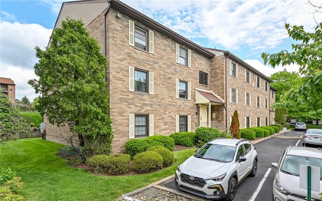 1556 Fairmont St, Wilkinsburg, PA 15221 - view of property featuring uncovered parking