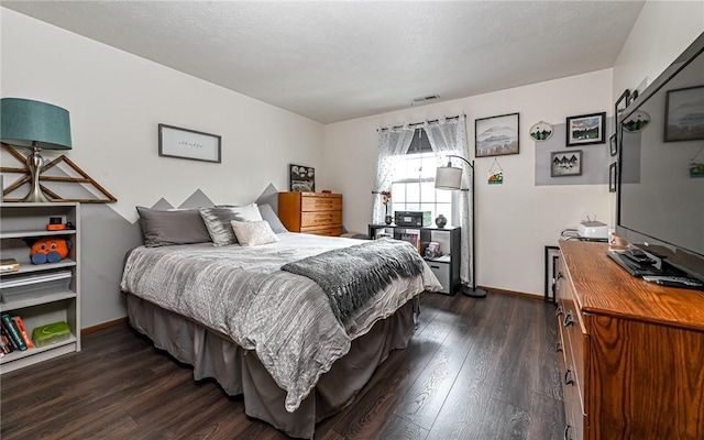 1556 Fairmont St, Wilkinsburg, PA 15221 - bedroom with dark wood-type flooring and baseboards