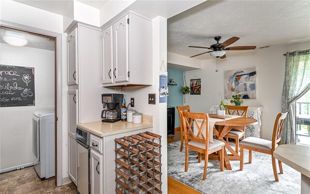 1556 Fairmont St, Wilkinsburg, PA 15221 - dining room featuring washer / dryer, ceiling fan, and a textured ceiling