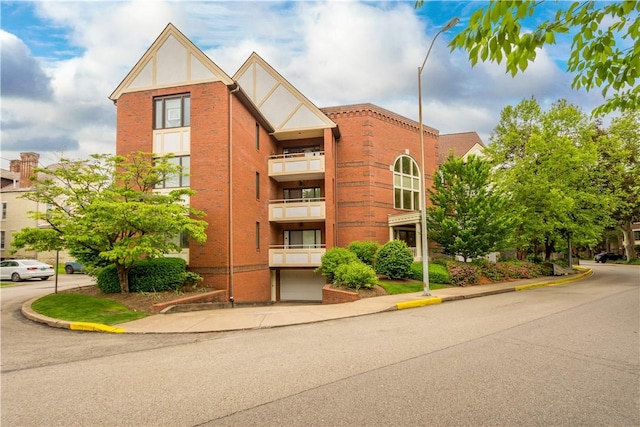 100 Denniston St Unit 211, Shadyside, PA 15206 - view of building exterior with a garage