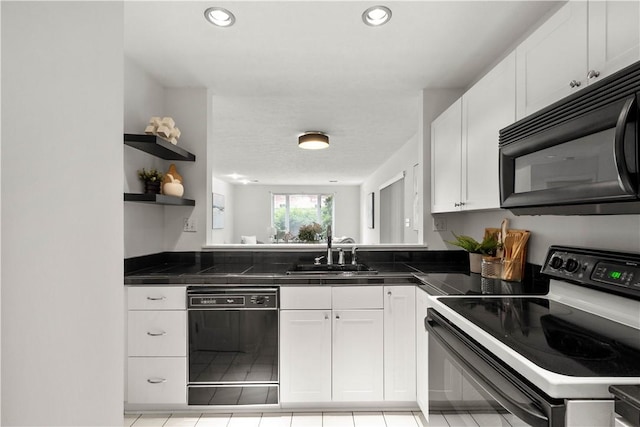 100 Denniston St Unit 211, Shadyside, PA 15206 - kitchen with black appliances, a sink, white cabinets, dark countertops, and recessed lighting