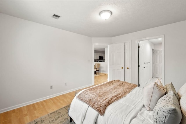 100 Denniston St Unit 211, Shadyside, PA 15206 - bedroom featuring baseboards and light wood-style flooring