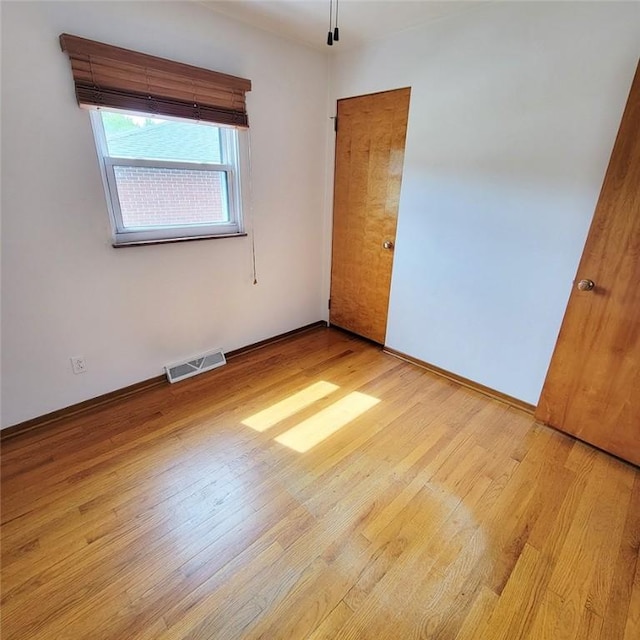 2216 Manor Dr, Manor Twp, PA 16226 - unfurnished bedroom with wood finished floors and baseboards