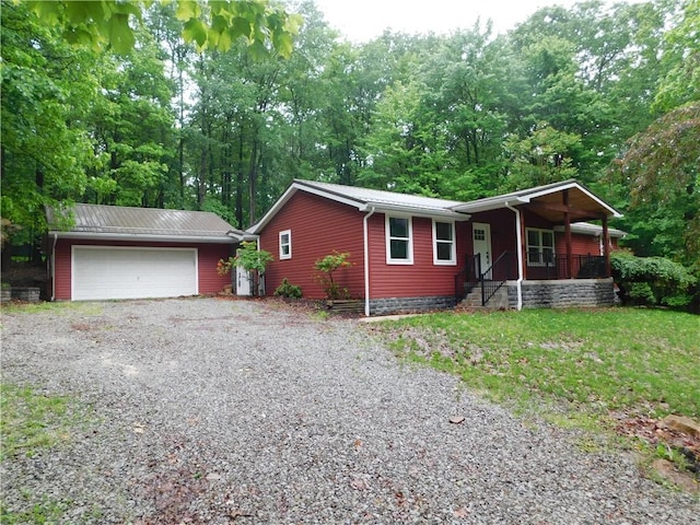 763 W Mountainview Rd, Bullskin Twp, PA 15610 - ranch-style house with covered porch, a garage, and metal roof