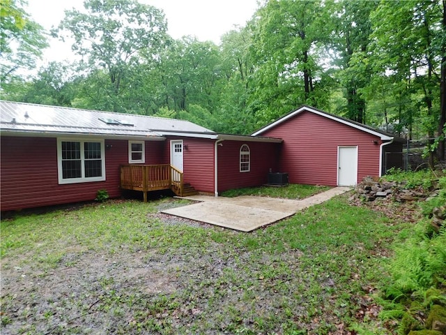763 W Mountainview Rd, Bullskin Twp, PA 15610 - rear view of house with a patio area, central AC unit, metal roof, and a wooden deck