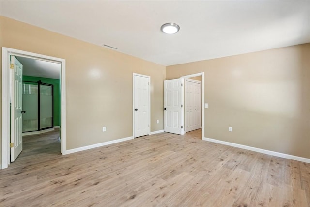 763 W Mountainview Rd, Bullskin Twp, PA 15610 - unfurnished bedroom featuring baseboards and light wood finished floors