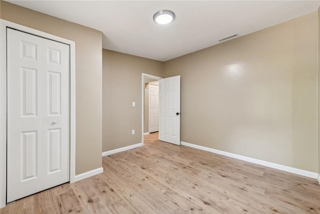 763 W Mountainview Rd, Bullskin Twp, PA 15610 - unfurnished bedroom with baseboards and light wood-type flooring