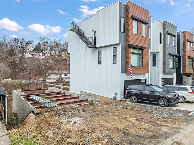 424 Clarence St, West End, PA 15211 - view of property exterior with an attached garage and a residential view