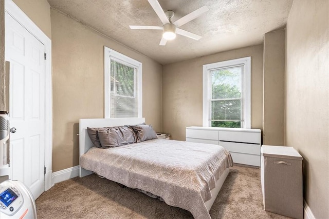 639 Tingley Ave, Bellevue, PA 15202 - bedroom with light carpet, a ceiling fan, a textured ceiling, and baseboards