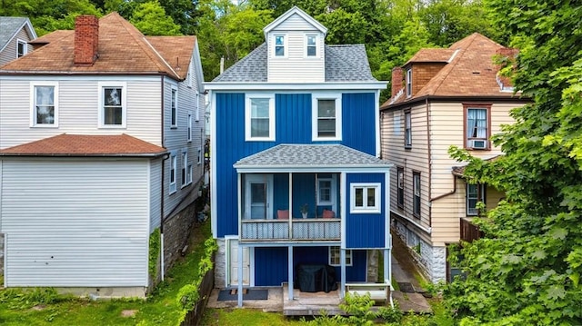 639 Tingley Ave, Bellevue, PA 15202 - rear view of house featuring a shingled roof, a sunroom, and board and batten siding