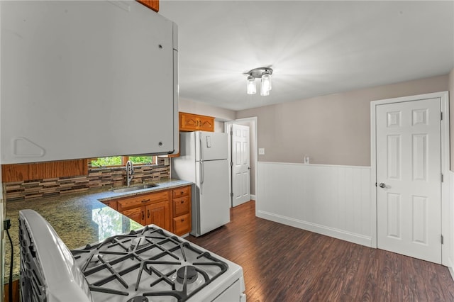 110 Steinbach Ln, Jefferson Hills, PA 15025 - kitchen featuring white appliances, a sink, brown cabinets, dark wood-style floors, and wainscoting