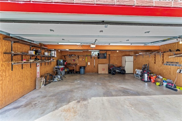 110 Steinbach Ln, Jefferson Hills, PA 15025 - garage with wooden walls, a garage door opener, and freestanding refrigerator