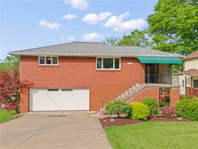 110 Steinbach Ln, Jefferson Hills, PA 15025 - view of front of property featuring an attached garage, driveway, brick siding, and roof with shingles
