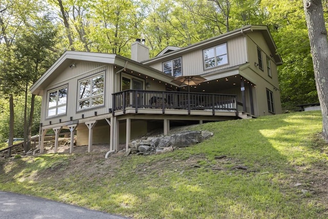 2226 County Line Rd, Donegal Wml, PA 15622 - rear view of property with a wooden deck, a chimney, a yard, and view of scattered trees