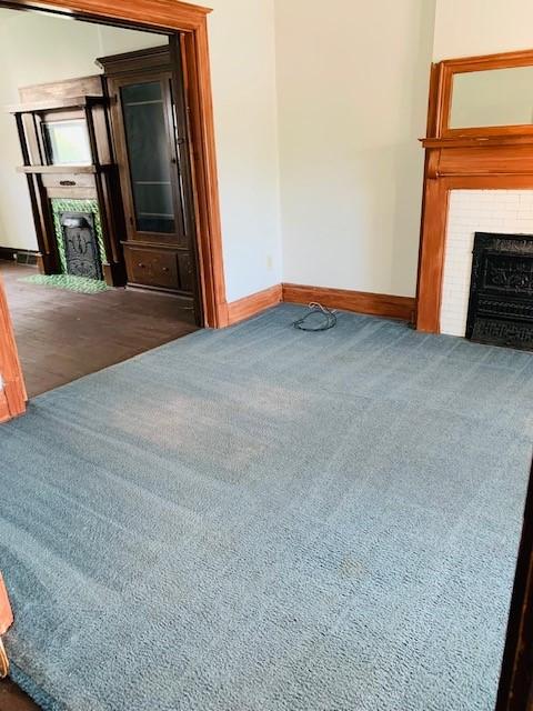 245-247 Semple St, Oakland, PA 15213 - carpeted living area featuring a fireplace with flush hearth and baseboards