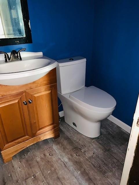 245-247 Semple St, Oakland, PA 15213 - bathroom featuring vanity, toilet, and wood finished floors