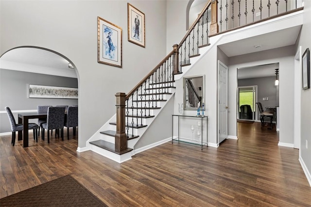 9264 Marshall, Cranberry Twp, PA 16066 - stairway with wood finished floors, arched walkways, baseboards, and a high ceiling