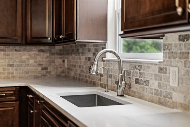 9264 Marshall, Cranberry Twp, PA 16066 - kitchen featuring a sink, dark brown cabinets, light countertops, and tasteful backsplash
