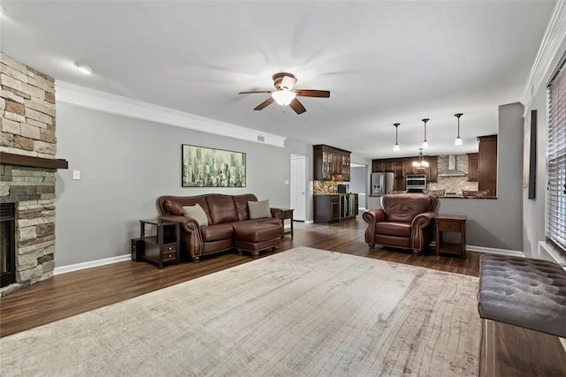 9264 Marshall, Cranberry Twp, PA 16066 - living area featuring a fireplace, a ceiling fan, dark wood finished floors, ornamental molding, and baseboards