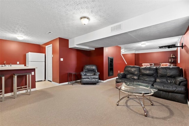 9264 Marshall, Cranberry Twp, PA 16066 - living room featuring bar with sink, carpet, a textured ceiling, and baseboards