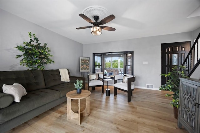220 Cortina Way, Overbrook, PA 15234 - living area with light wood-type flooring, a ceiling fan, stairs, and baseboards