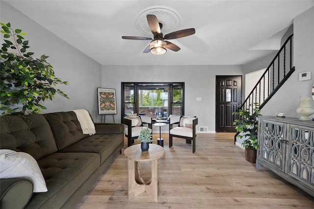 220 Cortina Way, Overbrook, PA 15234 - living room featuring ceiling fan, stairway, light wood-type flooring, and baseboards