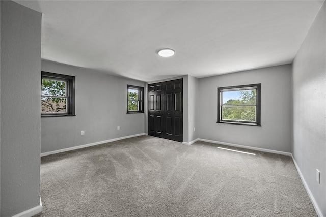 220 Cortina Way, Overbrook, PA 15234 - unfurnished bedroom with multiple windows, carpet floors, and baseboards