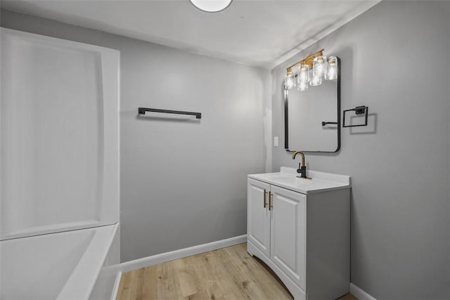 220 Cortina Way, Overbrook, PA 15234 - bathroom featuring vanity, wood finished floors, baseboards, and a tub