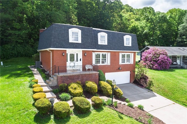 110 Ardennes Ct, Trafford, PA 15085 - view of front of property featuring a shingled roof, mansard roof, driveway, and brick siding