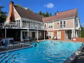 824 Kingsberry Cir, Mt Lebanon, PA 15234 - back of house with a community pool, a chimney, and a patio