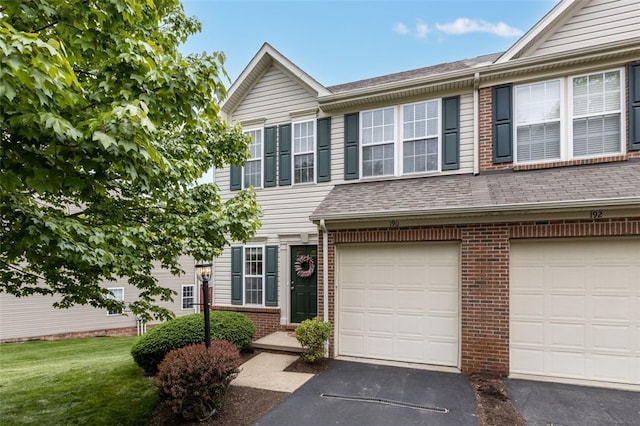 190 Southern Valley Ct, Adams Twp, PA 16046 - view of property with brick siding, driveway, a shingled roof, a front yard, and a garage