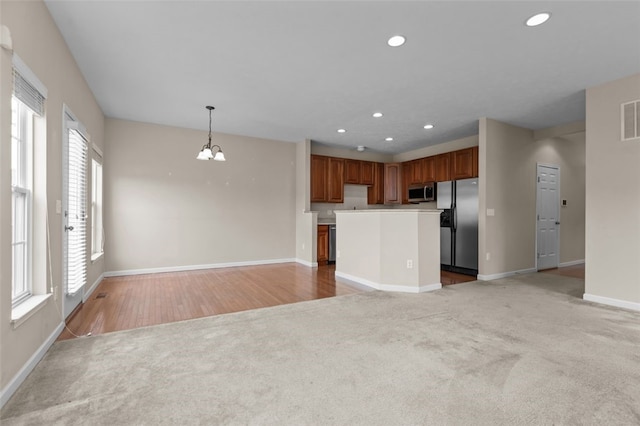 190 Southern Valley Ct, Adams Twp, PA 16046 - unfurnished living room featuring light colored carpet, baseboards, recessed lighting, and a chandelier