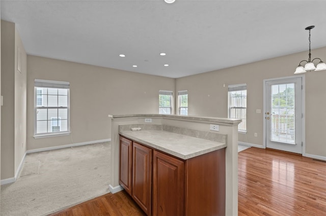 190 Southern Valley Ct, Adams Twp, PA 16046 - kitchen with baseboards, light countertops, brown cabinetry, light wood-style floors, and recessed lighting