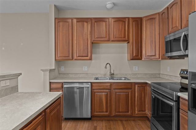 190 Southern Valley Ct, Adams Twp, PA 16046 - kitchen with appliances with stainless steel finishes, a sink, light countertops, and brown cabinets