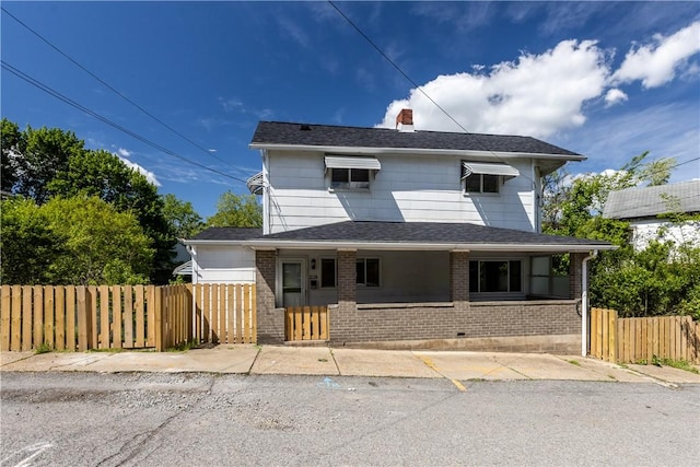 228 Marion St, Mckees Rocks, PA 15136 - view of front of home with brick siding and a chimney