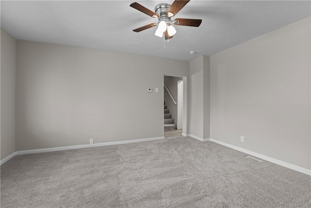 228 Marion St, Mckees Rocks, PA 15136 - empty room featuring ceiling fan, stairway, carpet flooring, and baseboards