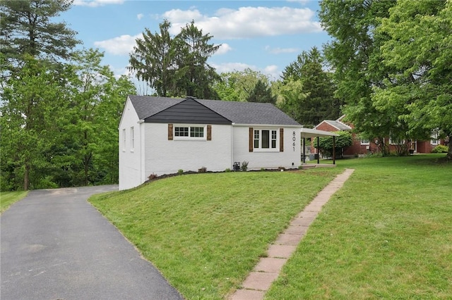 8061 Lindisfarne Dr, Mccandless, PA 15237 - single story home featuring a front yard and brick siding