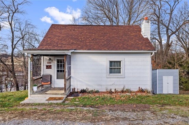 1194-1226 Lewis Ave, Robinson Twp Nwa, PA 15108 - view of front facade with roof with shingles, a chimney, and an outdoor structure