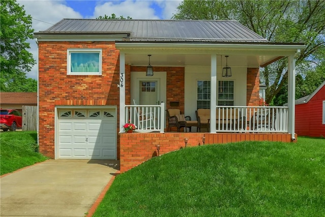 304 Petain St, Ellwood City Law, PA 16117 - view of front of home with brick siding, an attached garage, driveway, and covered porch