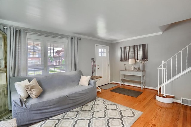 304 Petain St, Ellwood City Law, PA 16117 - living room featuring crown molding, stairs, wood finished floors, and baseboards