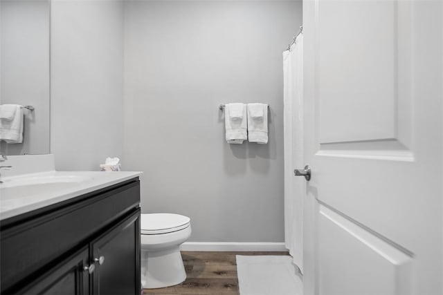 303 Tillary Ln Unit 201, Cranberry Twp, PA 16066 - bathroom featuring vanity, toilet, and wood finished floors