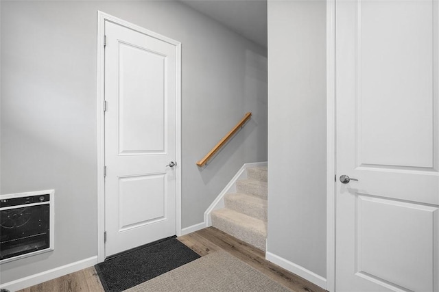 303 Tillary Ln Unit 201, Cranberry Twp, PA 16066 - stairs with heating unit, wood finished floors, and baseboards