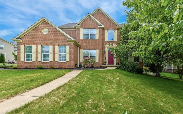 122 Brighton Ln, Adams Twp, PA 16046 - view of front facade with a front lawn and brick siding